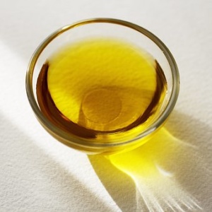 yellow oil in glass